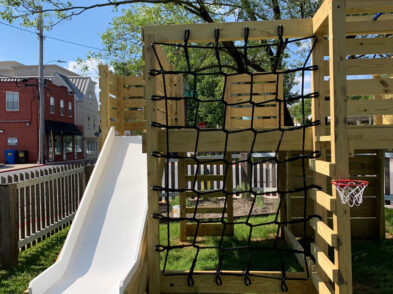 Jungle Gym with slide and climbing net and basketball hoop