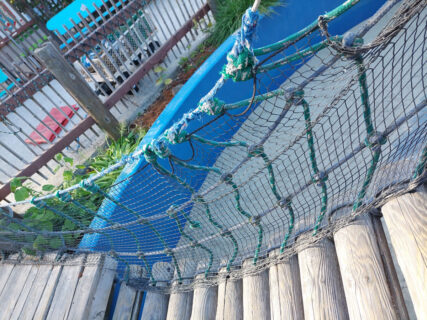 Rope for a bridge at a park looking from above