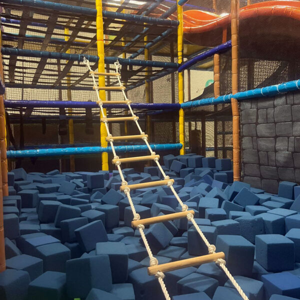 Rope ladder displayed inside a play gym.