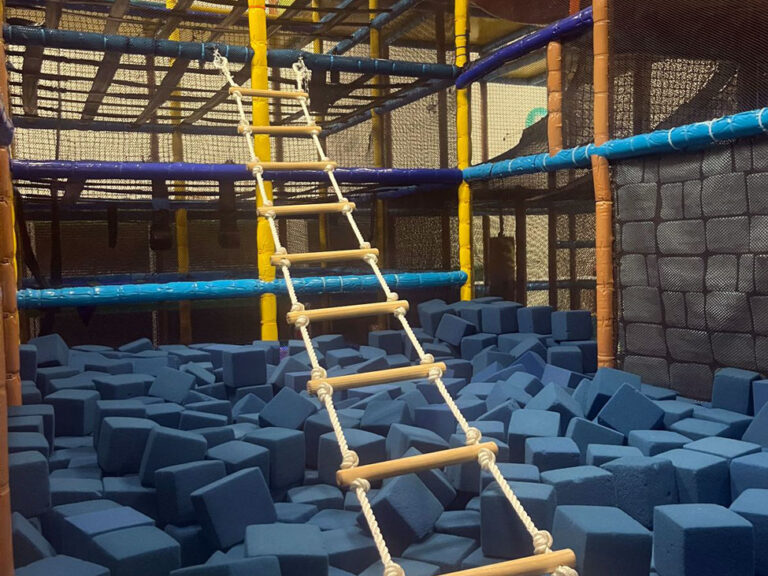 Rope ladder displayed inside a play gym.